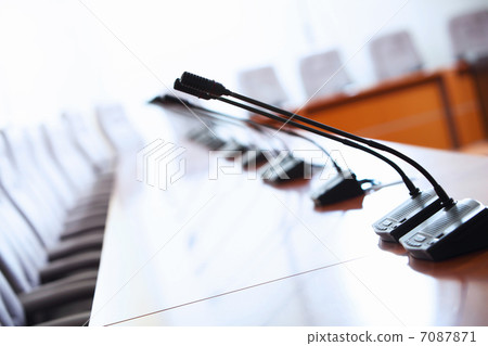 Conference hall with microphones 7087871