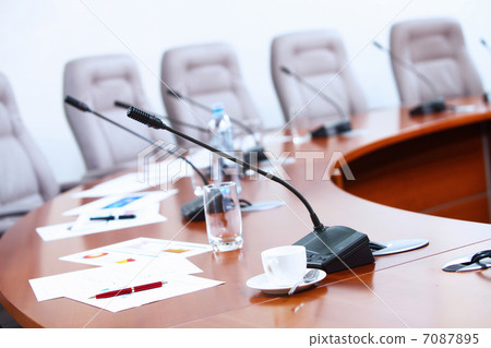 Conference hall with microphones 7087895
