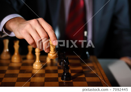 Businessman playing chess 7092445