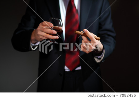 Man with cognac and cigar Man with cognac and cigar 7092456