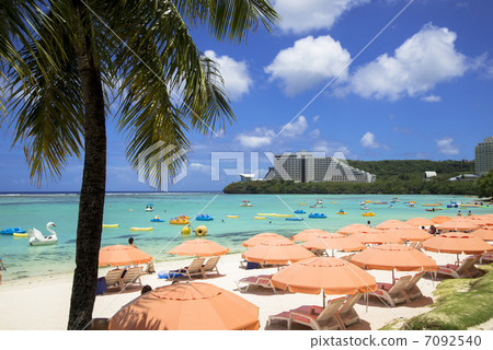 Seas and umbrellas on Guam Island 7092540