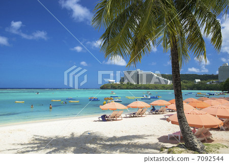 Seas and umbrellas on Guam Island 7092544