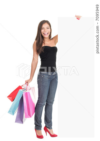 Woman showing shopping sign copy space 7095949