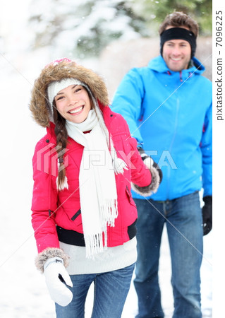 Happy winter couple in snow Happy winter couple in snow 7096225