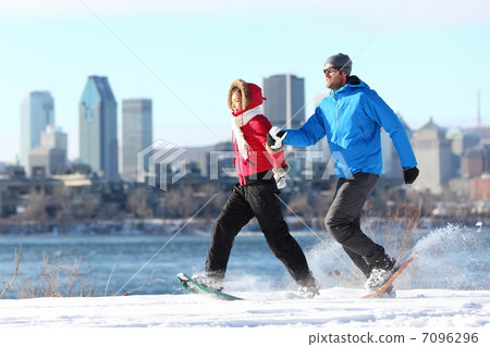 Winter couple fun on snowshoe in Montreal Winter couple fun on snowshoe in Montreal 7096296
