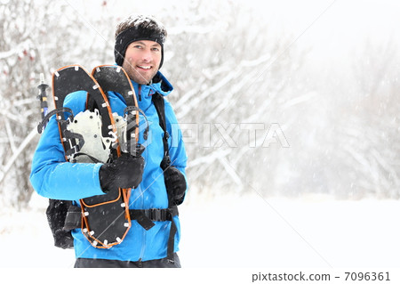 winter snowshoeing man winter snowshoeing man 7096361