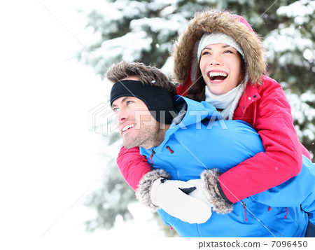 Winter couple happy piggyback 7096450