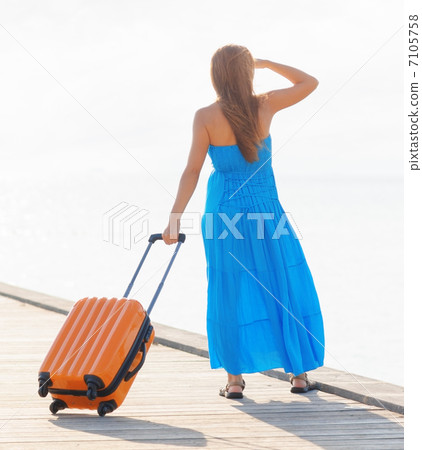 Young woman with suitcase on the pier Young woman with suitcase on the pier 7105758