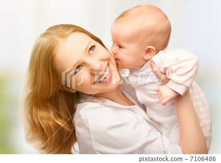 Happy cheerful family. Mother and baby kissing 7106486