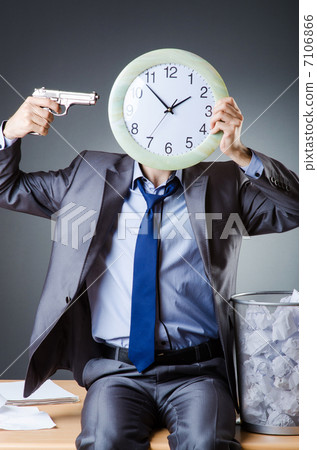 Man with clock and pile of papers Man with clock and pile of papers 7106866
