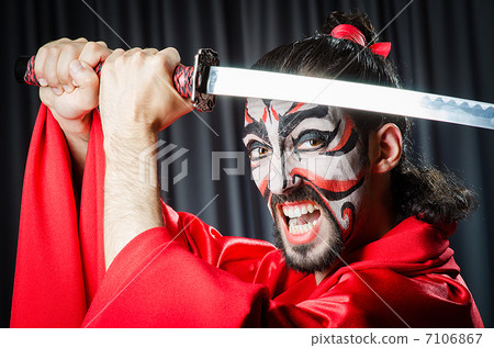 Man with sword and face mask 7106867