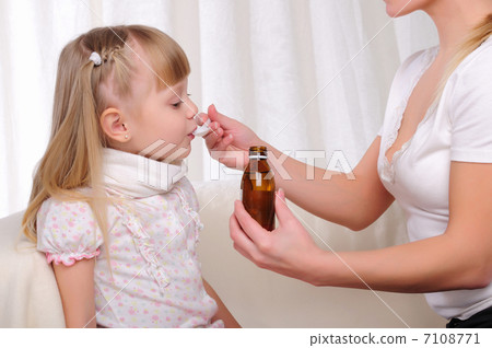 Little girl drinking cough syrup 7108771