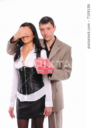 young man gives his girlfriend a gift young man gives his girlfriend a gift 7109186