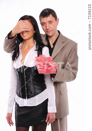 young man gives his girlfriend a gift young man gives his girlfriend a gift 7109220