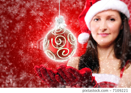Portrait of a young girl dressed as Santa Claus 7109221