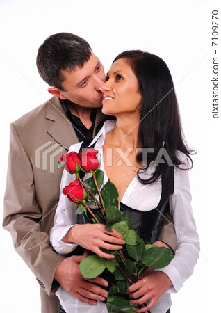 young man gives his girlfriend a rose 7109270