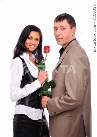 young man gives his girlfriend a rose 7109356