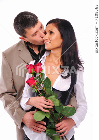 young man gives his girlfriend a rose 7109365