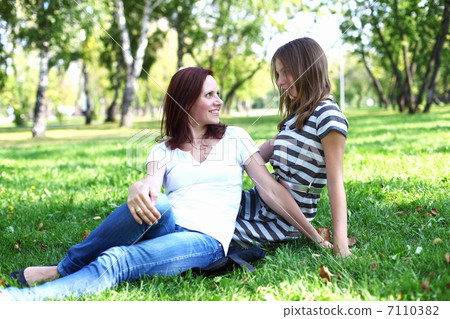 Mother with her daughter in summer park Mother with her daughter in summer park 7110382