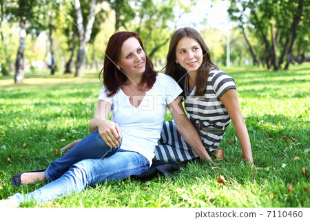 Mother with her daughter in summer park Mother with her daughter in summer park 7110460