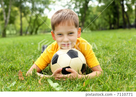 Little boy in the park with a ball Little boy in the park with a ball 7110771