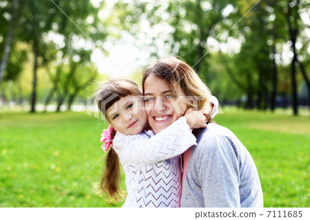 Mother and daughter in park Mother and daughter in park 7111685