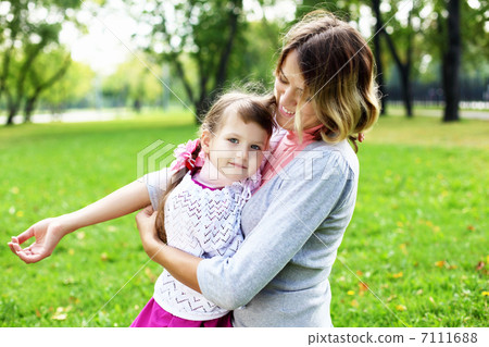 Mother and daughter in park Mother and daughter in park 7111688