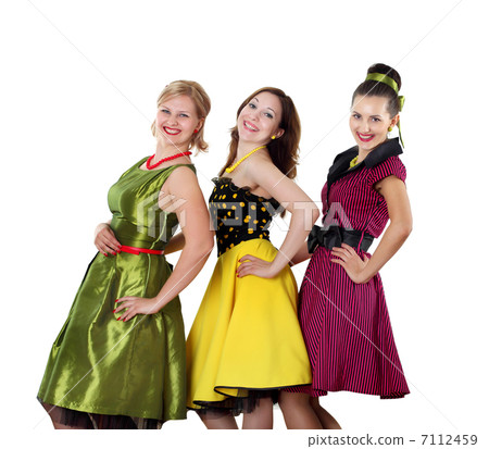 three young woman in bright colour dresses 7112459
