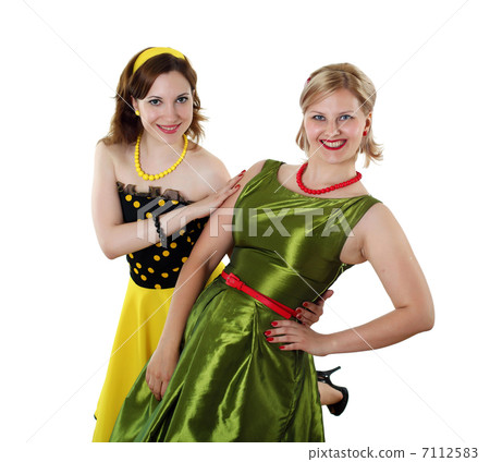 two young woman in bright colour dresses 7112583