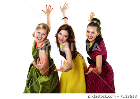 three young woman in bright colour dresses 7112638