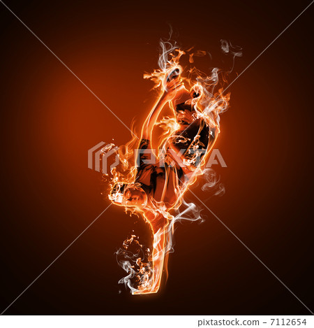 Fire dancer against black background 7112654