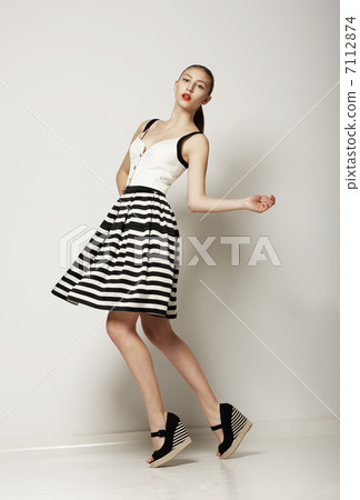 Fashion Style. Happy Young Shopper in Contrast Striped Grey Skirt. Movement Fashion Style. Happy Young Shopper in Contrast Striped Grey Skirt. Movement 7112874