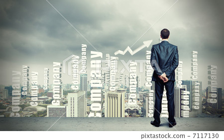 Businessman against cityscape 7117130