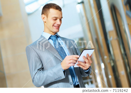 portrait of happy smiling young businesman portrait of happy smiling young businesman 7119242