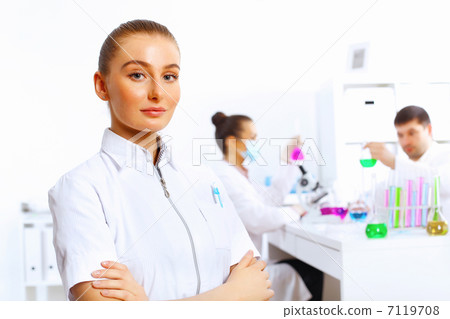 Team of scientists working in laboratory Team of scientists working in laboratory 7119708