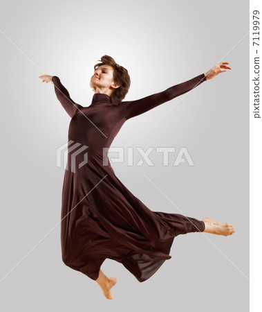Girl in dark dress dancing Girl in dark dress dancing 7119979