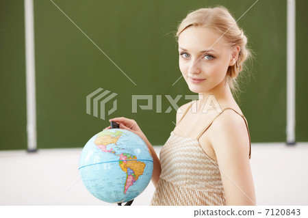Teacher at school with a globe 7120843