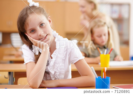 Little girl at school class 7120891