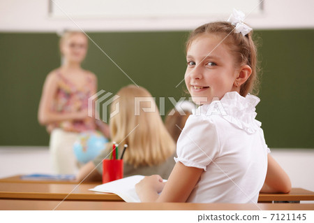 Little girl at school class Little girl at school class 7121145