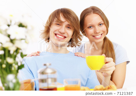 Couple at home drinking tea Couple at home drinking tea 7121387