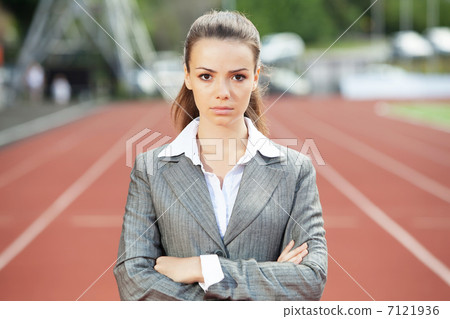 Business woman at athletic stadium Business woman at athletic stadium 7121936