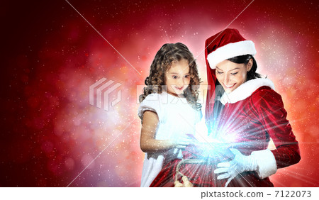 Little girl with christmas gifts and santa Little girl with christmas gifts and santa 7122073