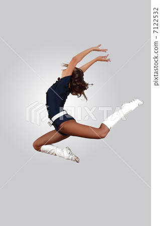 Young female dancer against white background 7122532