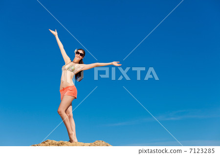 Portrait of young woman in bikini at beach Portrait of young woman in bikini at beach 7123285
