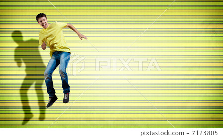 young man dancing and jumping... 7123805