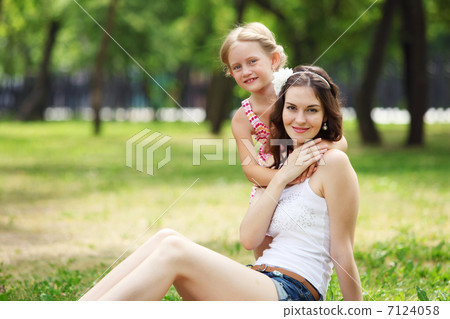 Mother and daughter in the park Mother and daughter in the park 7124058