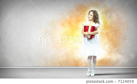Happy girl opening gift box 7124059