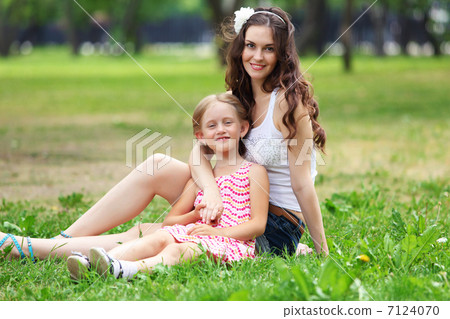 Mother and daughter in the park Mother and daughter in the park 7124070