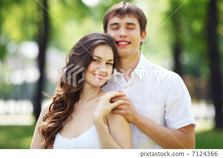 Young love Couple smiling under blue sky Young love Couple smiling under blue sky 7124366