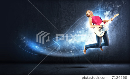 young woman playing on electro guitar and jumping young woman playing on electro guitar and jumping 7124368